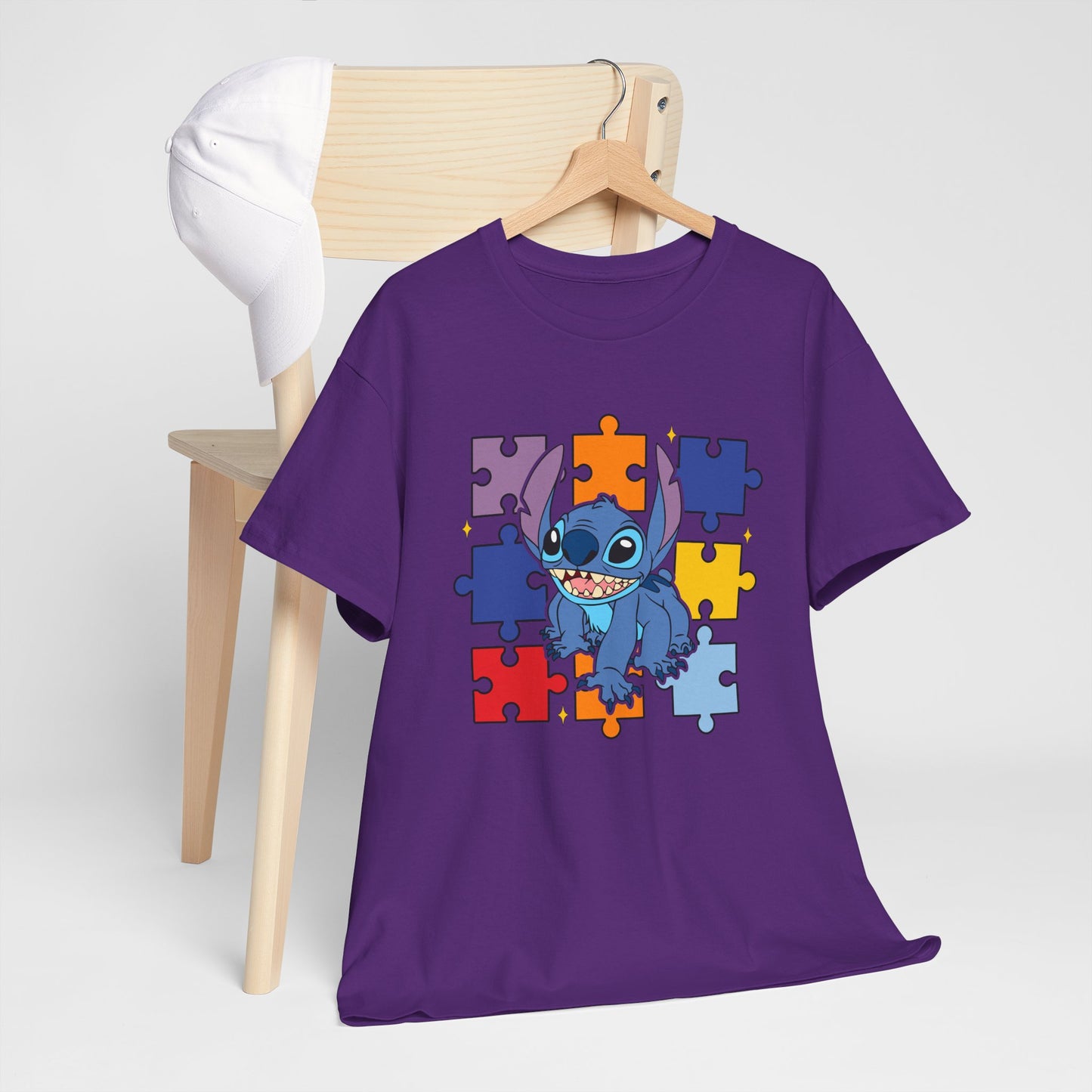 Puzzle Pieces Tee — Cute Blue Alien Character on Colorful Autism Puzzle Background