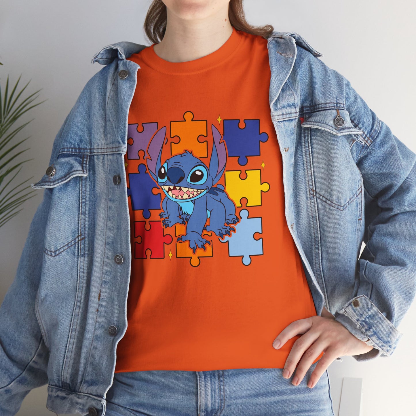 Puzzle Pieces Tee — Cute Blue Alien Character on Colorful Autism Puzzle Background