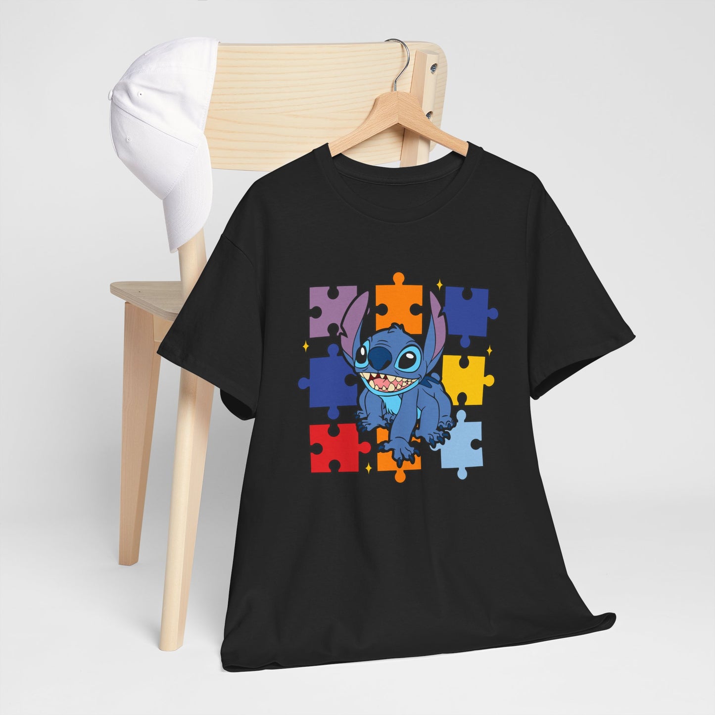 Puzzle Pieces Tee — Cute Blue Alien Character on Colorful Autism Puzzle Background