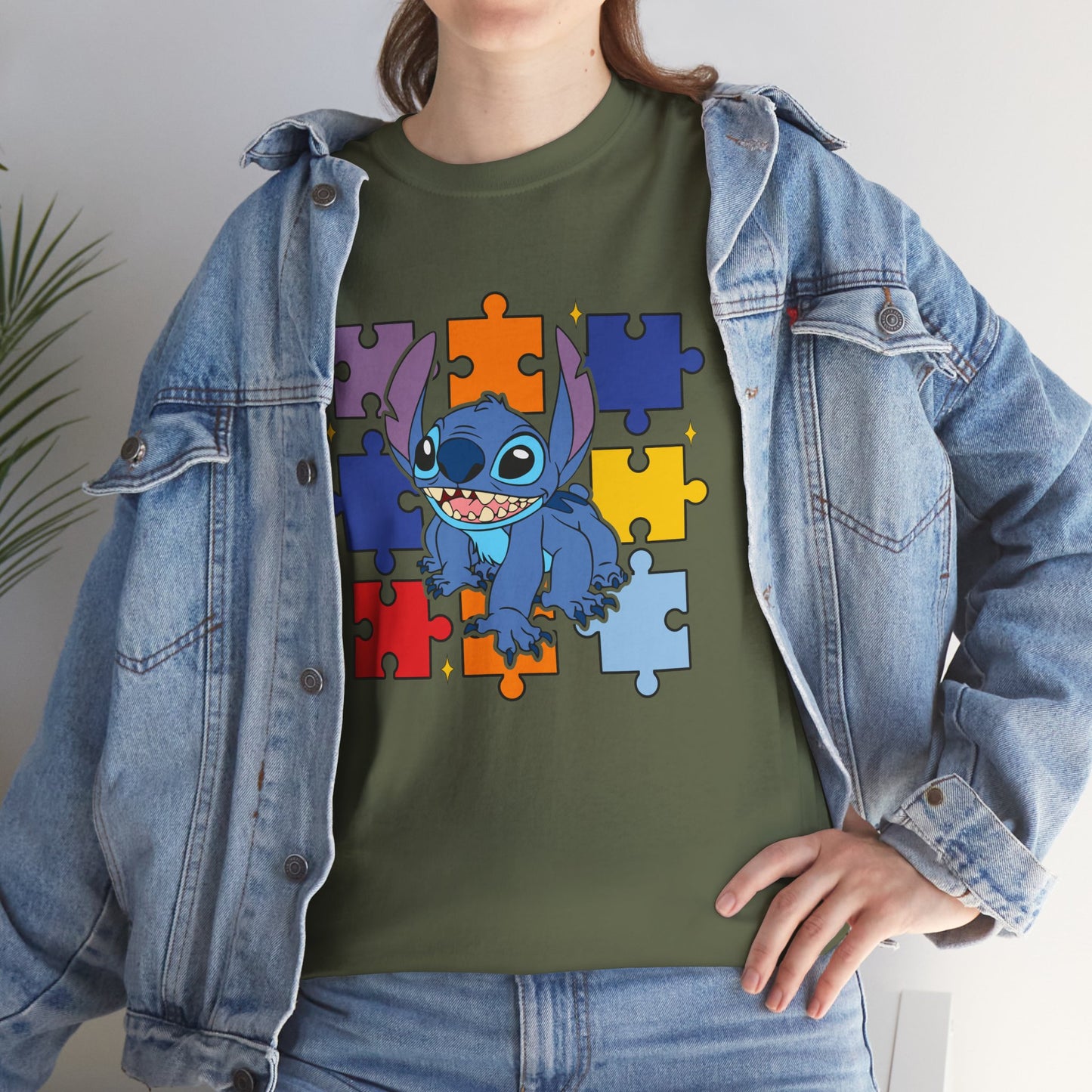 Puzzle Pieces Tee — Cute Blue Alien Character on Colorful Autism Puzzle Background