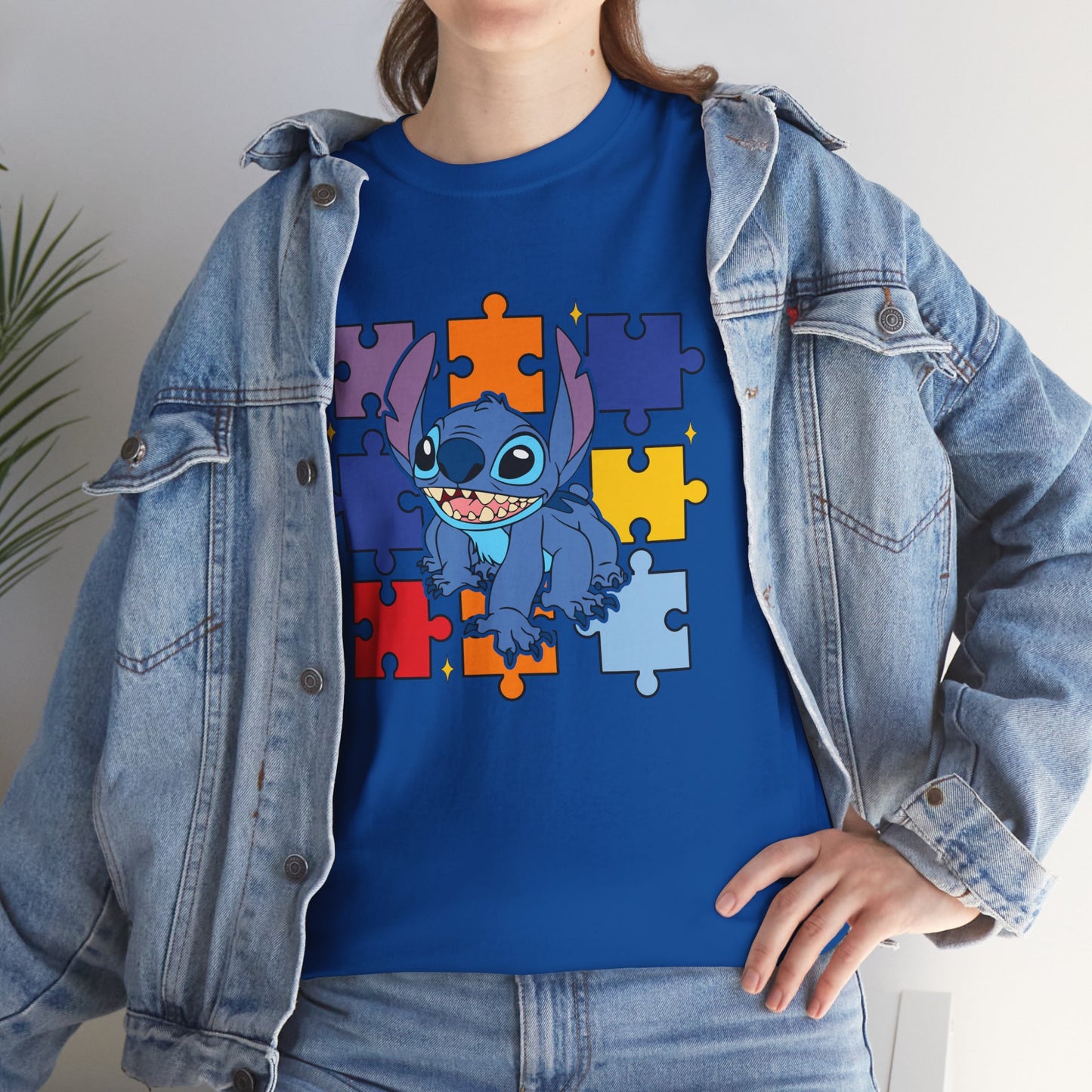 Puzzle Pieces Tee — Cute Blue Alien Character on Colorful Autism Puzzle Background