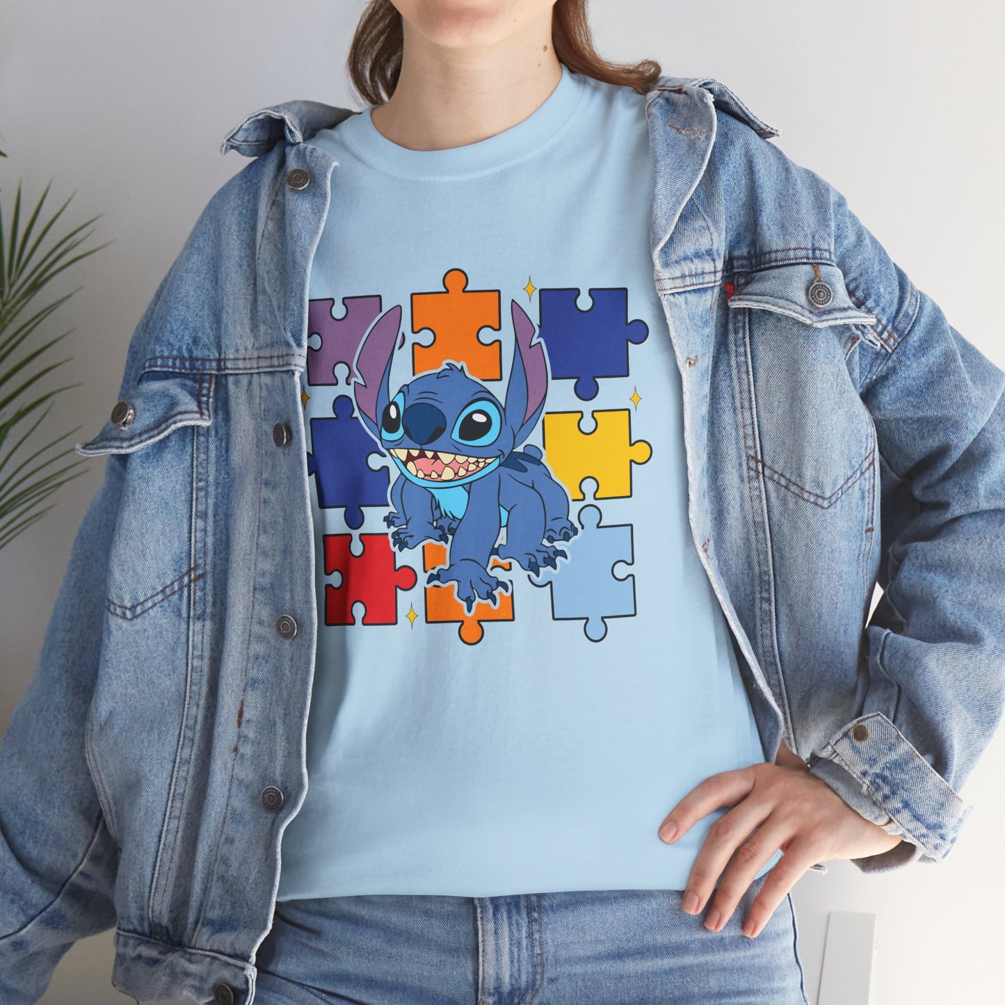 Puzzle Pieces Tee — Cute Blue Alien Character on Colorful Autism Puzzle Background