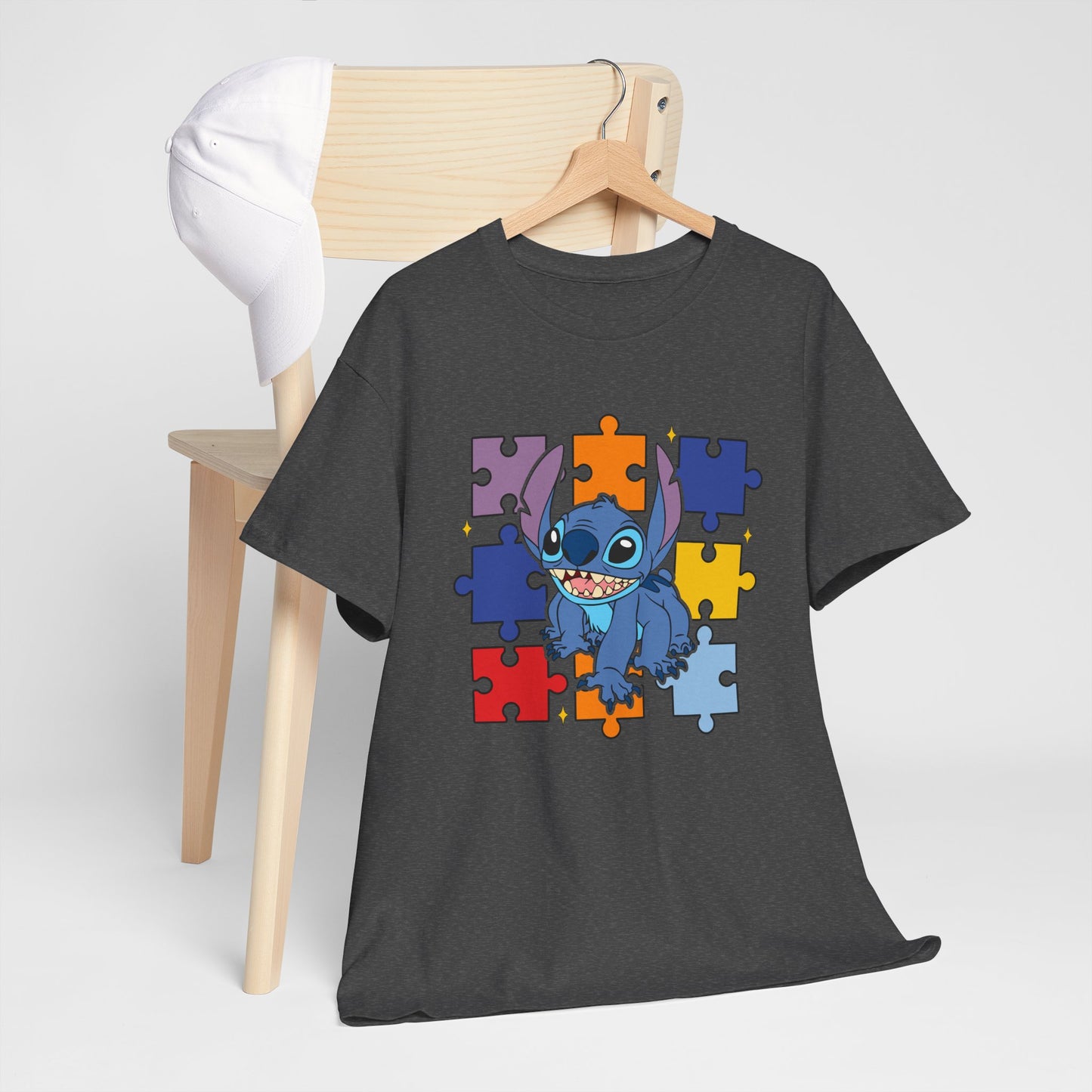 Puzzle Pieces Tee — Cute Blue Alien Character on Colorful Autism Puzzle Background