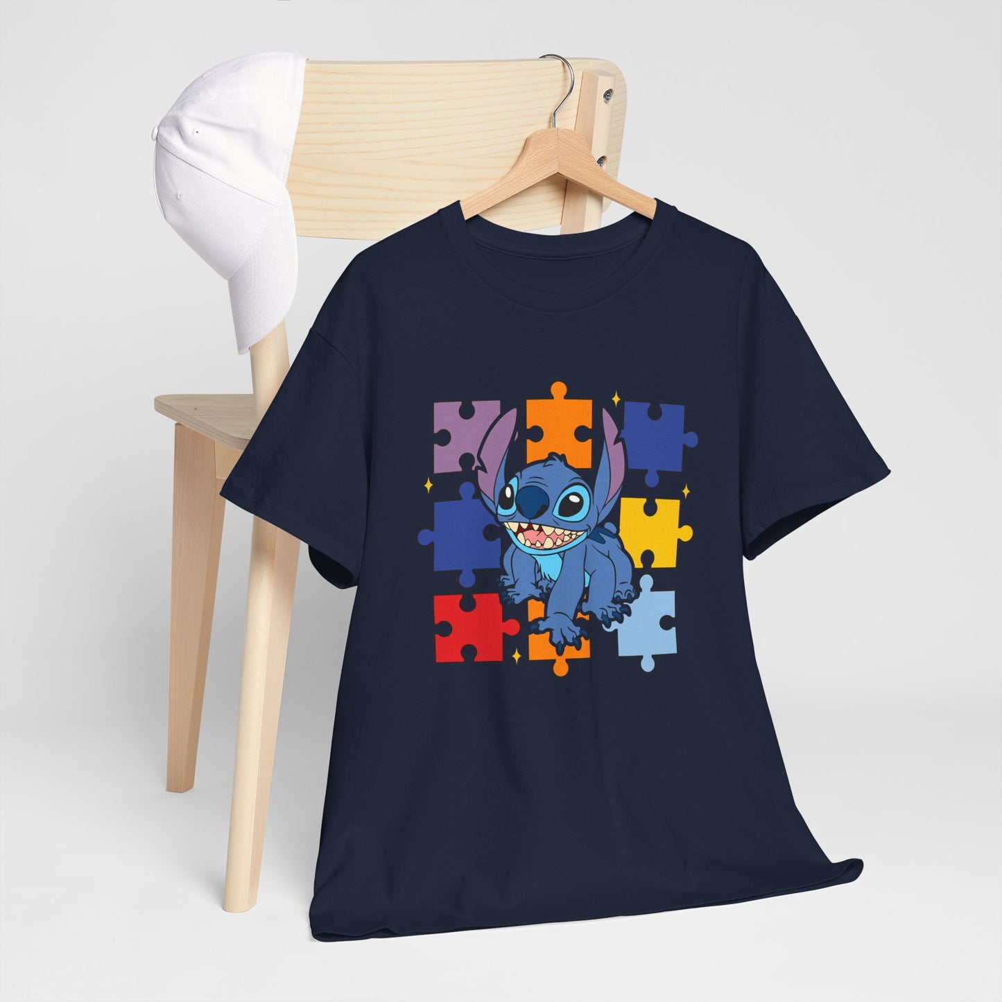 Puzzle Pieces Tee — Cute Blue Alien Character on Colorful Autism Puzzle Background