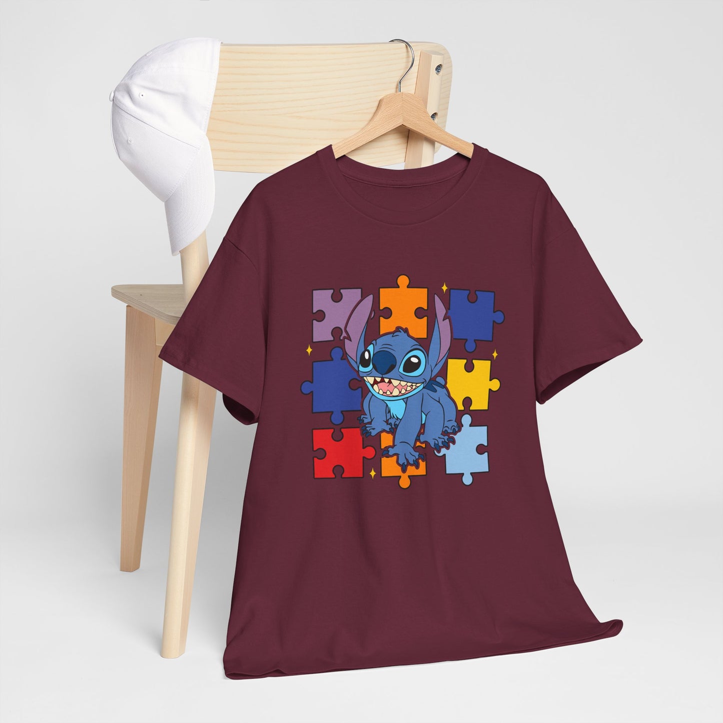 Puzzle Pieces Tee — Cute Blue Alien Character on Colorful Autism Puzzle Background