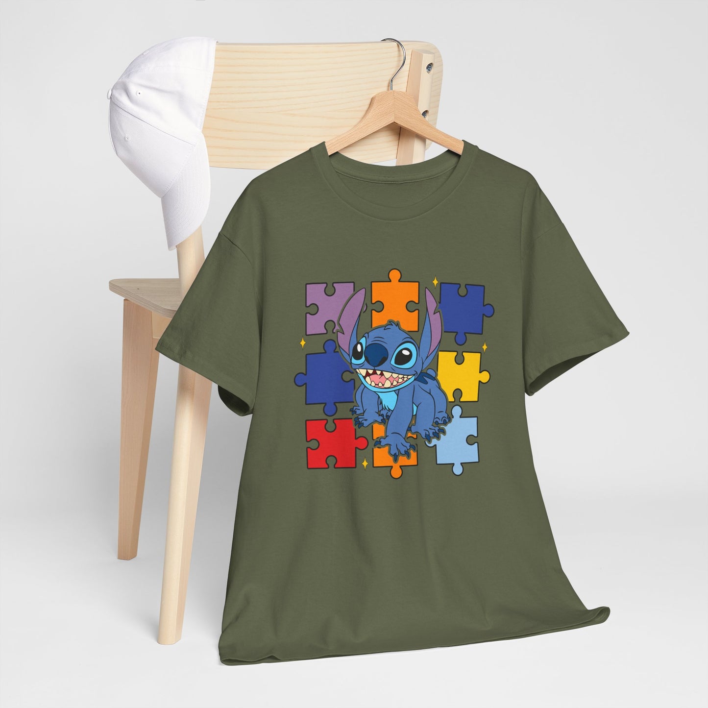 Puzzle Pieces Tee — Cute Blue Alien Character on Colorful Autism Puzzle Background