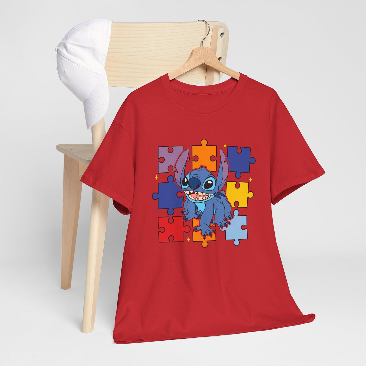 Puzzle Pieces Tee — Cute Blue Alien Character on Colorful Autism Puzzle Background